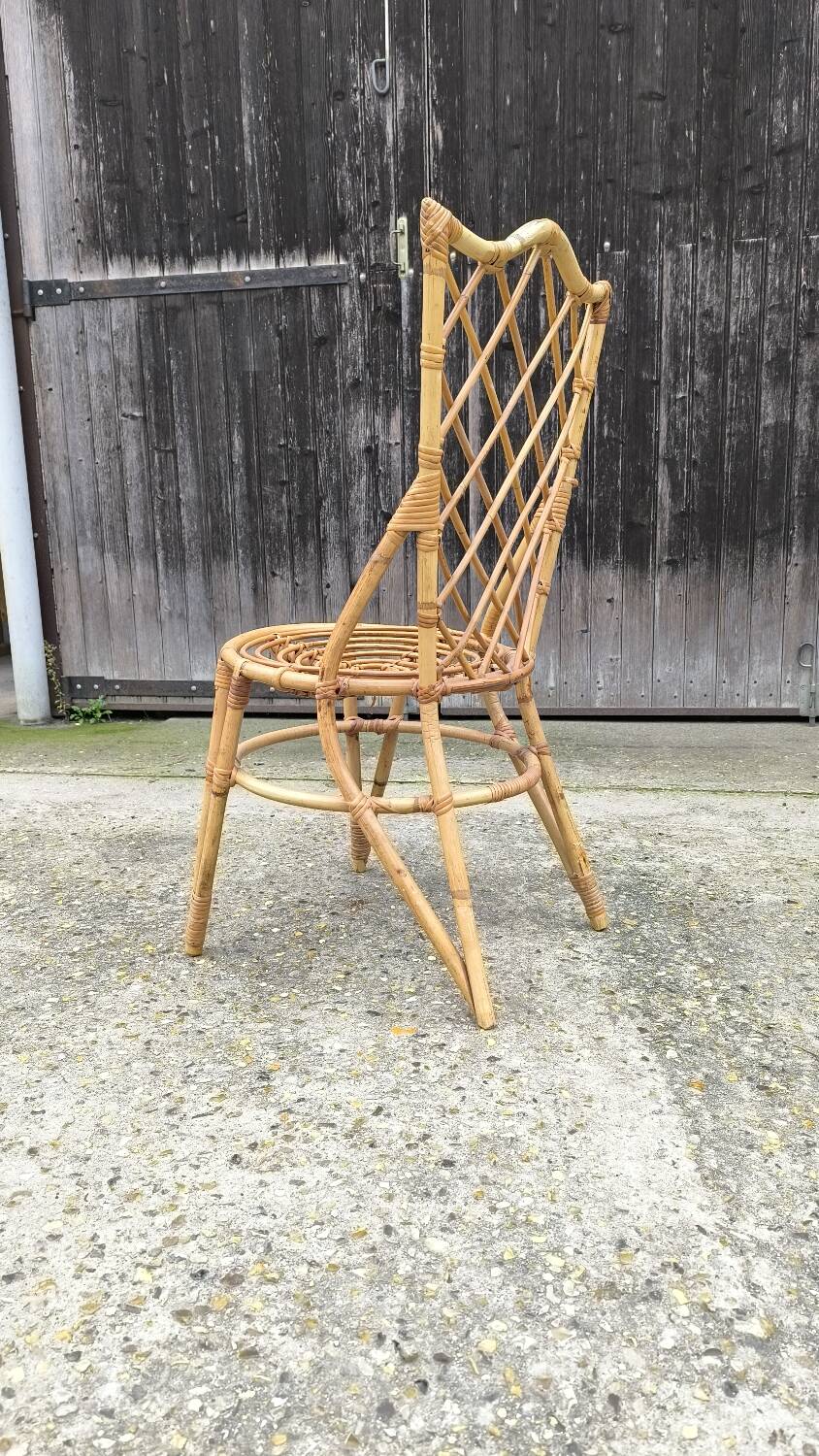 Rattan chair by Louis Sognot 1960