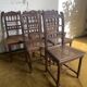 6 carved wooden chairs with cane seats