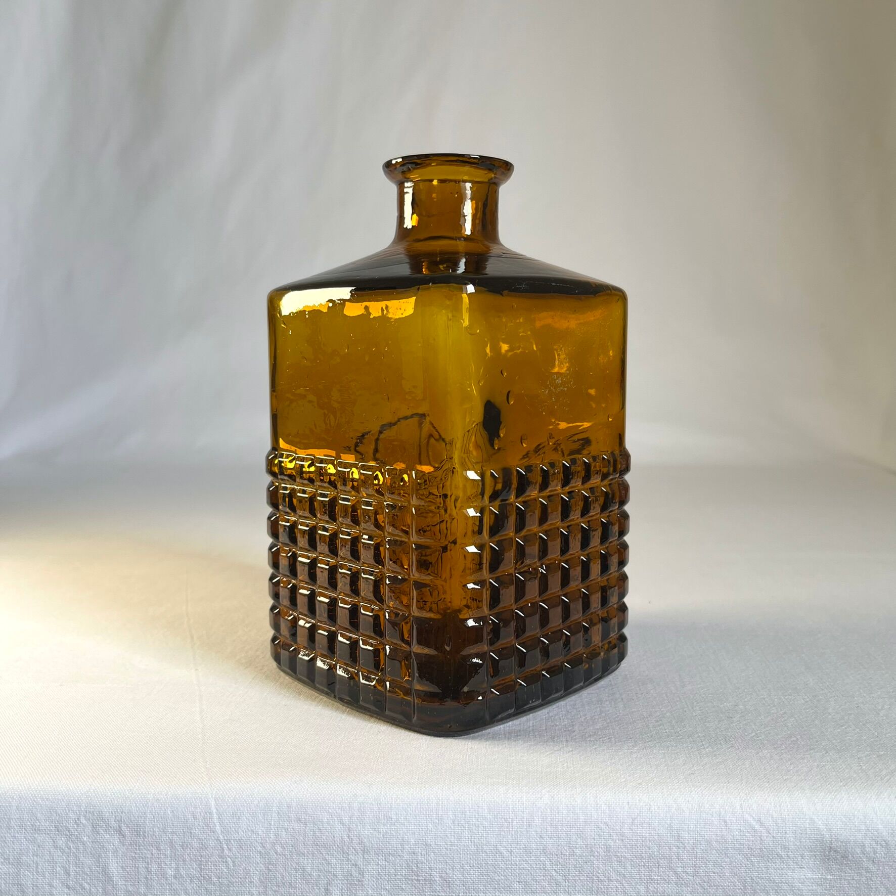 Amber glass and wood bottle