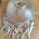 Retro brass lamp with a glass shade and bead fringes.