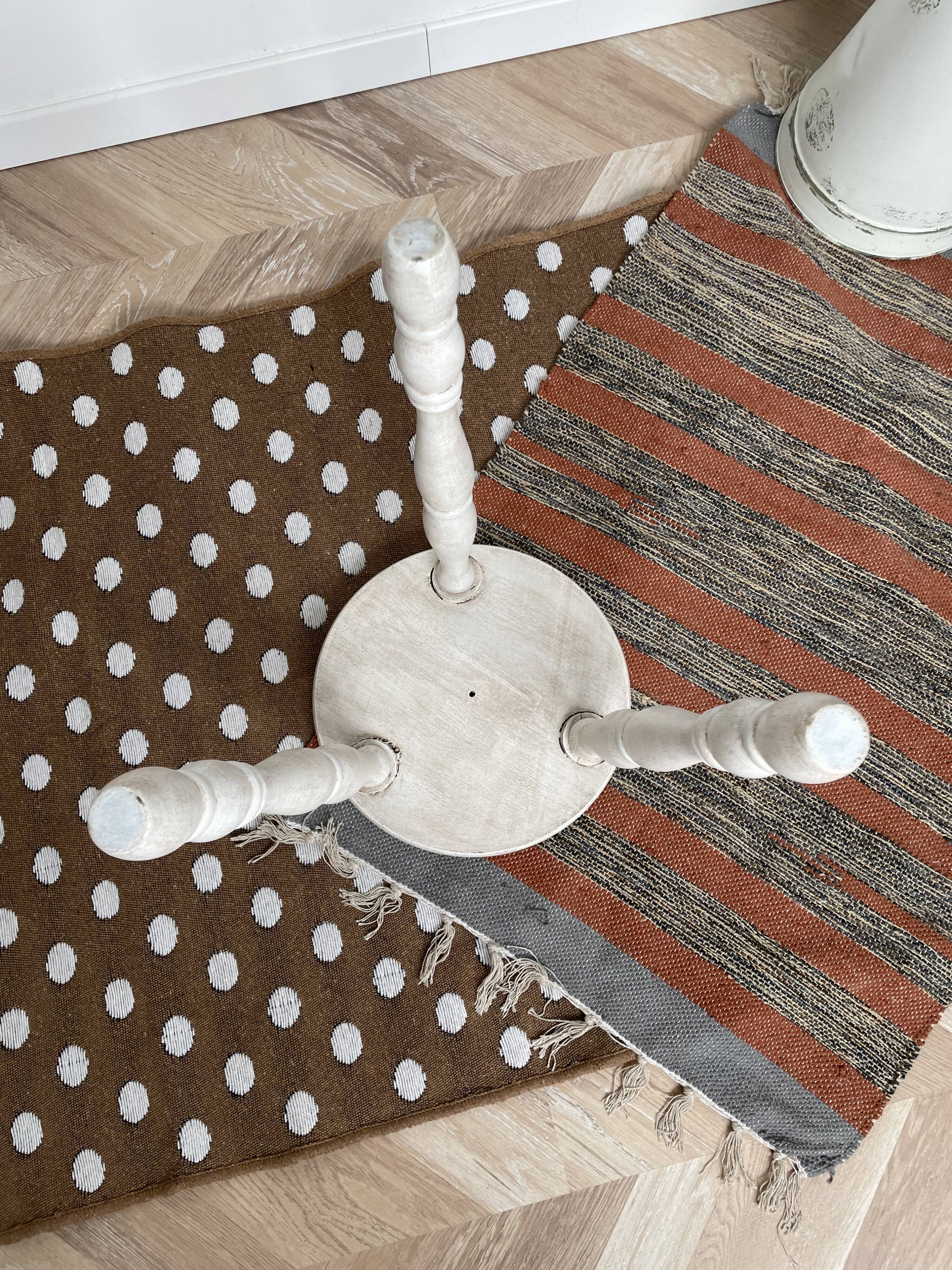 Patinated white tripod