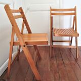 Pair of folding chairs with vintage solid wood slats