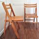 Pair of folding chairs with vintage solid wood slats