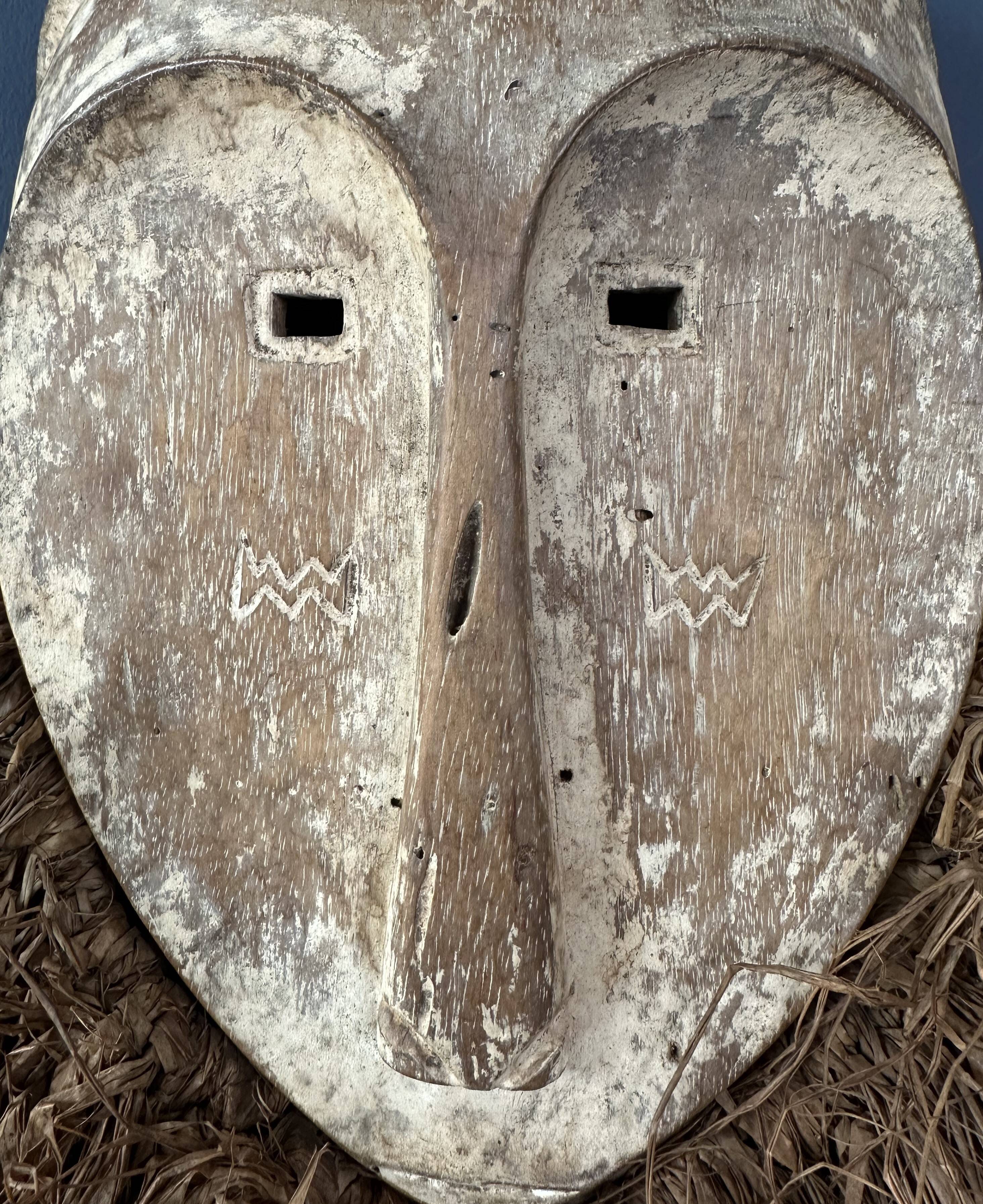Long face tribal mask with narrow eye-holes