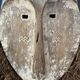 Long face tribal mask with narrow eye-holes