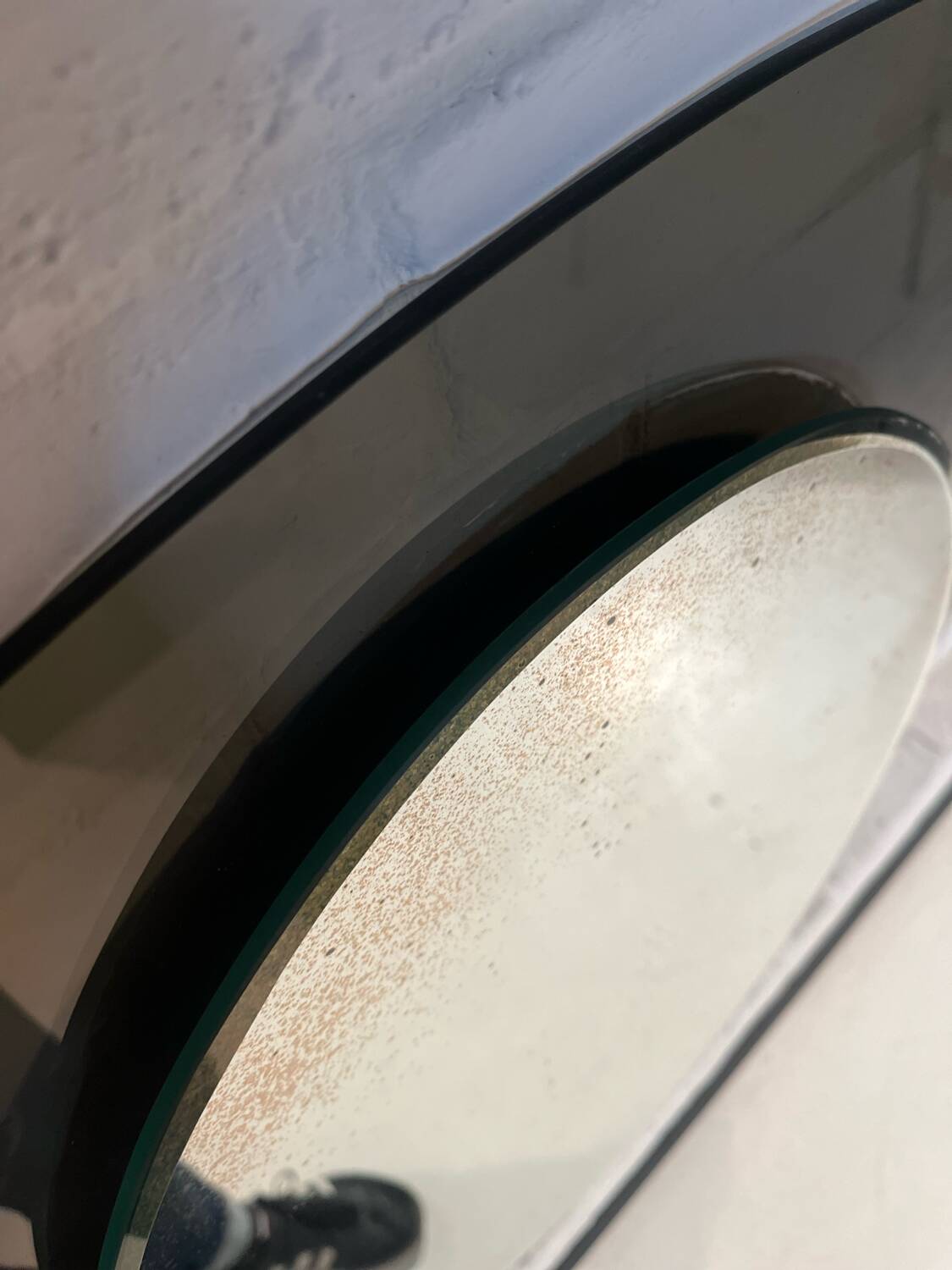 Vintage smoked glass mirror from around 1970.