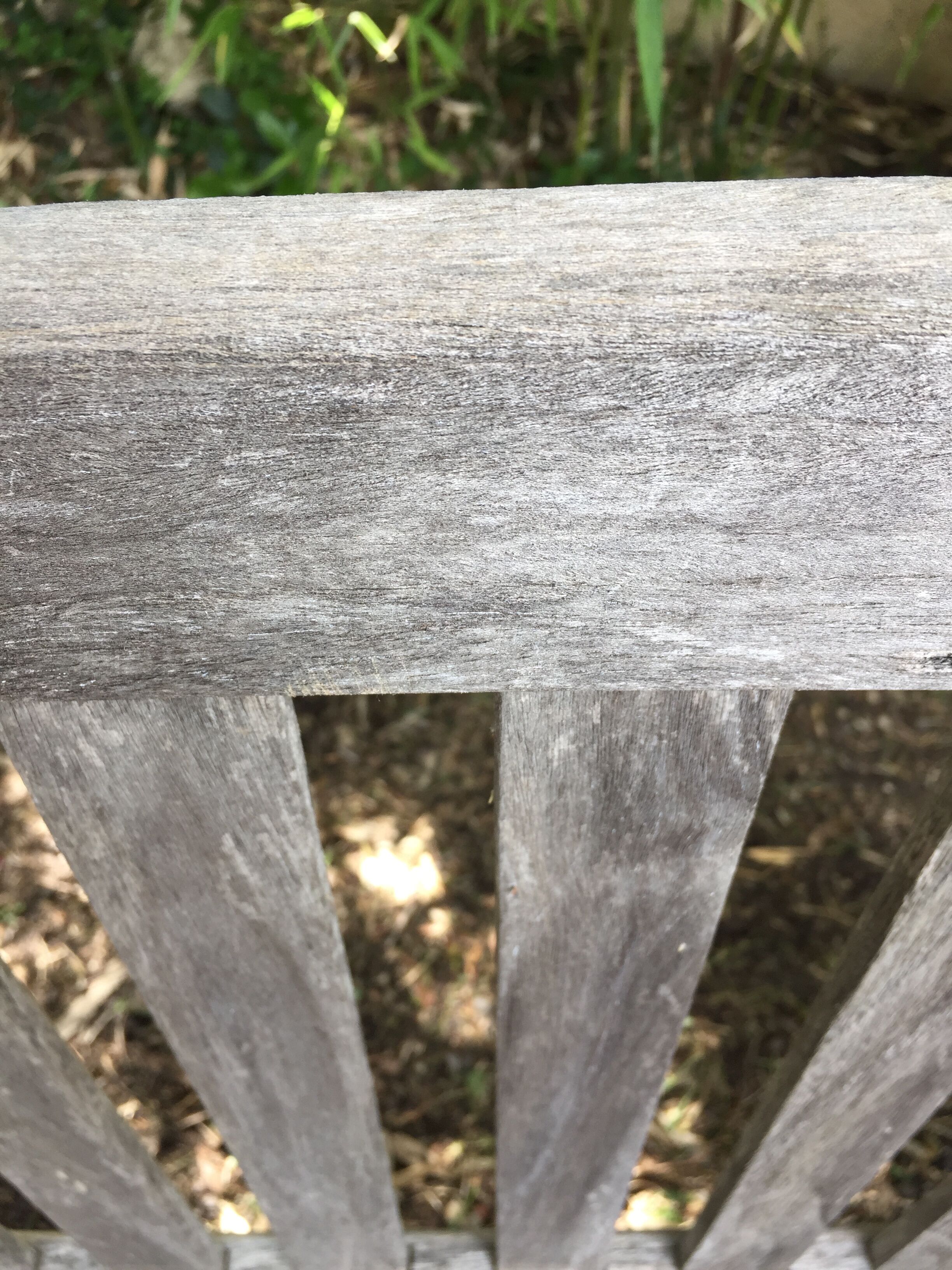 Vintage wooden garden bench with wheels