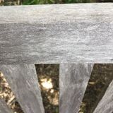 Vintage wooden garden bench with wheels