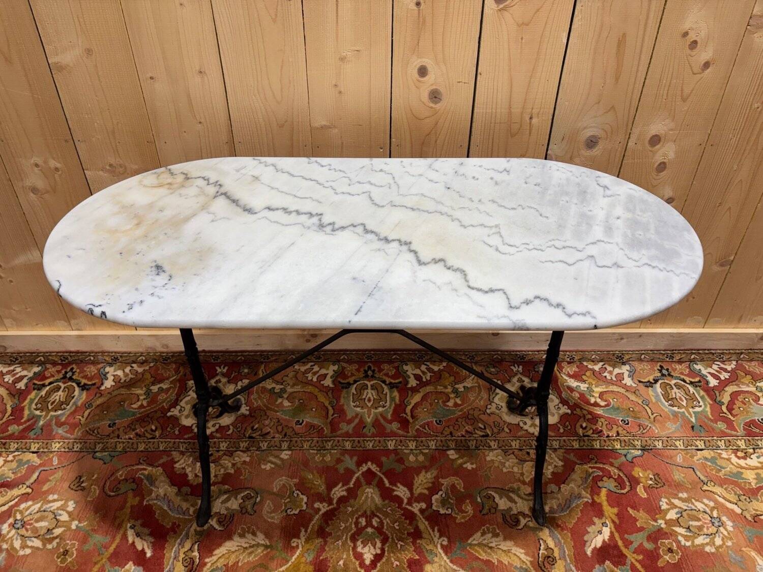 Authentic bistro table with white marble and cast iron from the early 20th century.