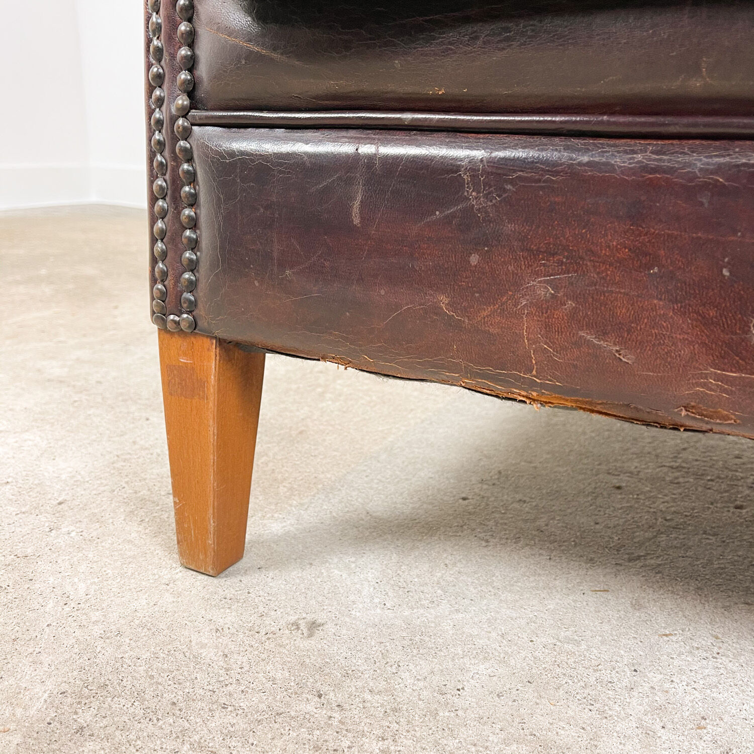Dark brown vintage sheep leather wingback armchair