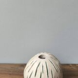 Small round ceramic ball vase with dried flower