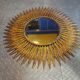 Miroir soleil en métal doré 62cm