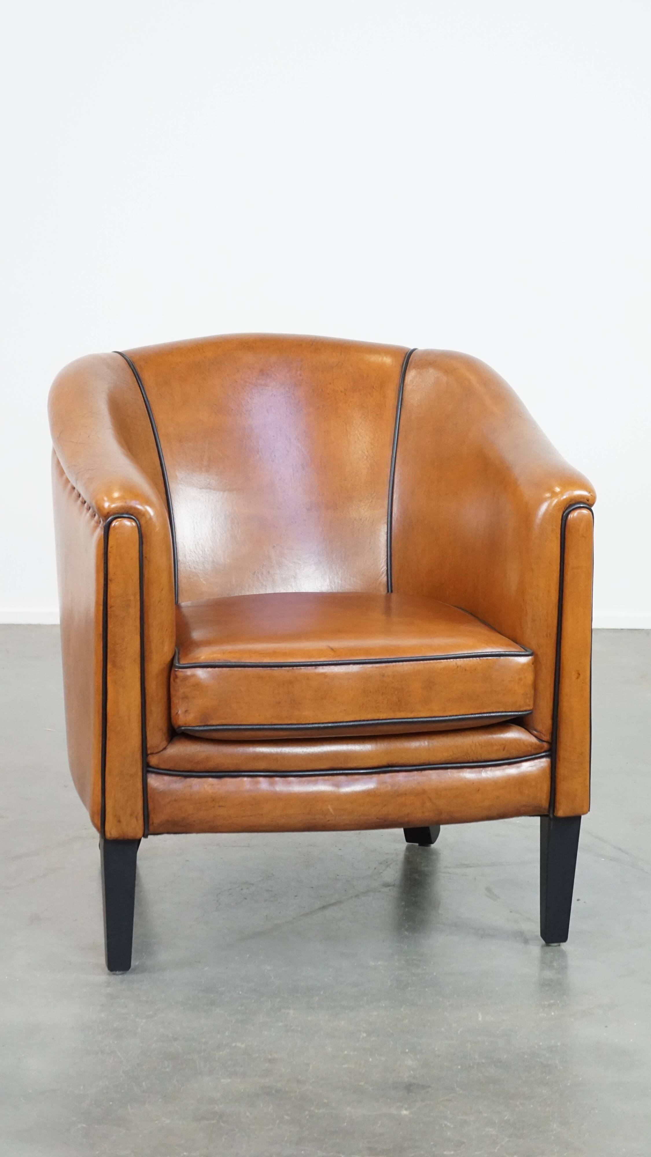 Sheep leather club chair finished with black piping
