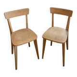Pair of vintage bistro chairs made of raw solid wood.