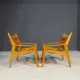 Pair of vintage wooden armchairs with leather upholstery, 20th century, 75 × 56 × 65 cm