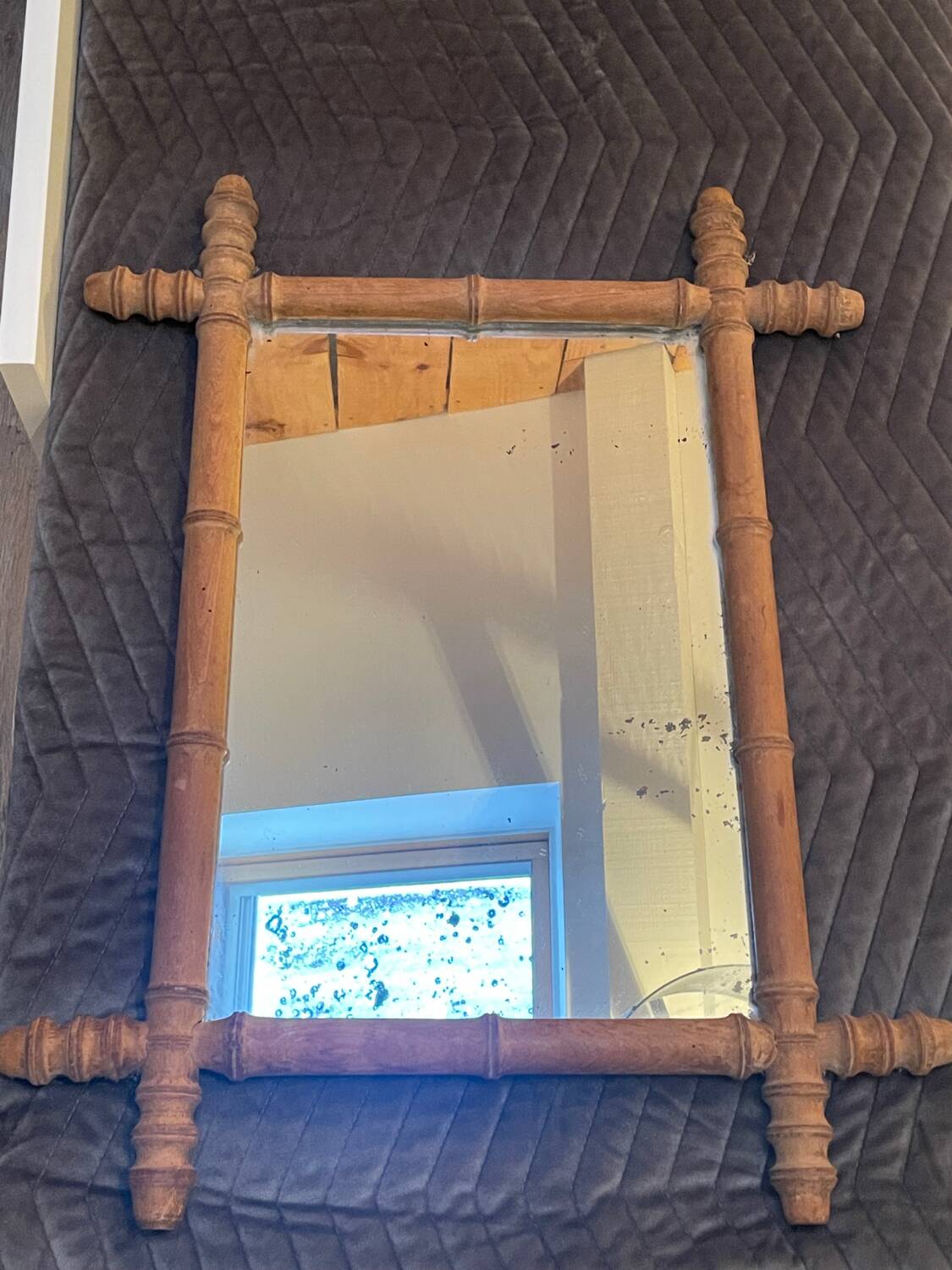 Carved wooden mirror in a bamboo style