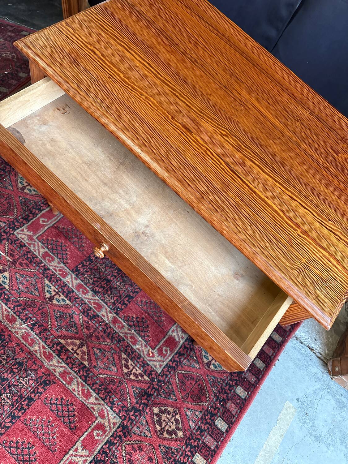 Small solid wood desk with a drawer.