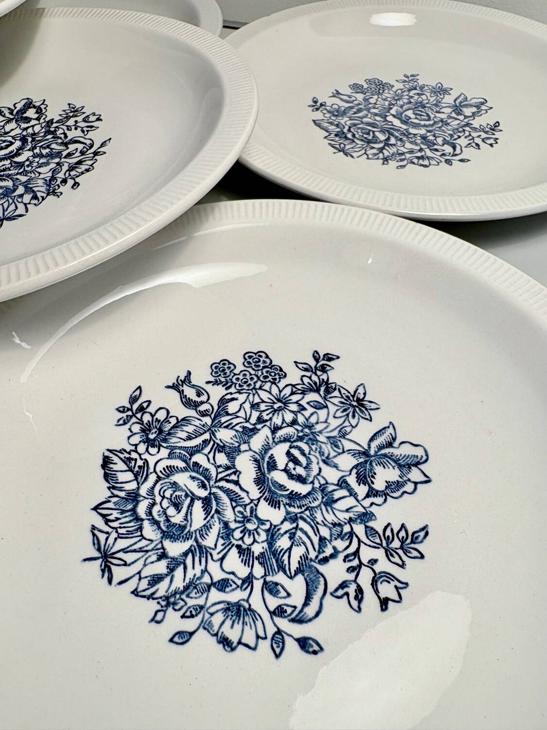 Set of 10 antique Lunéville flat plates – blue floral decoration