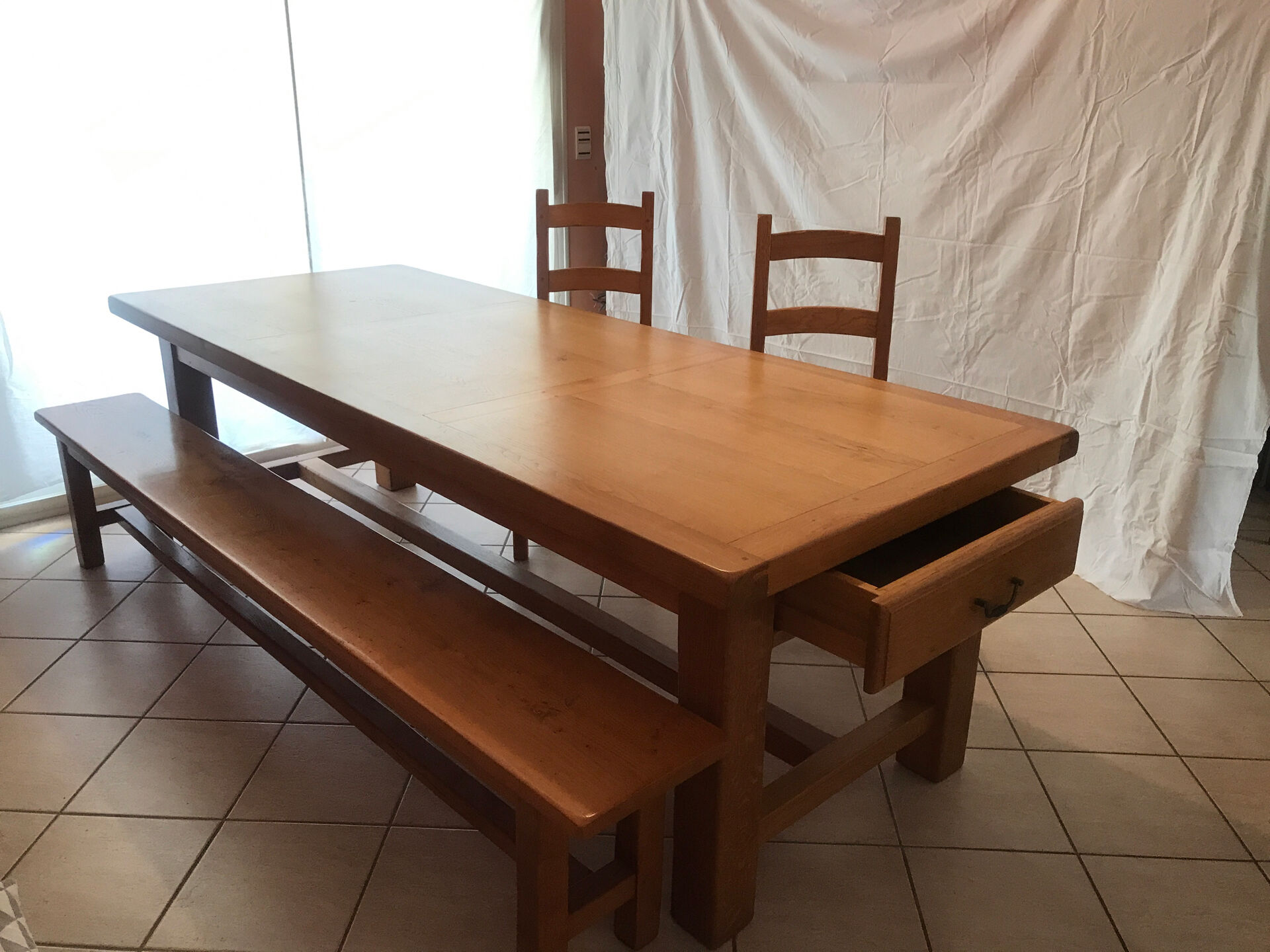 Solid oak dining table made by a craftsman cabinetmaker.
