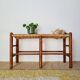 Old wooden and straw bench