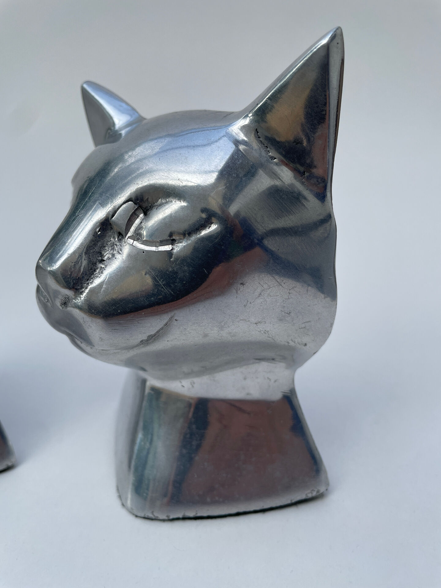 Pair of designer cat head bookends
