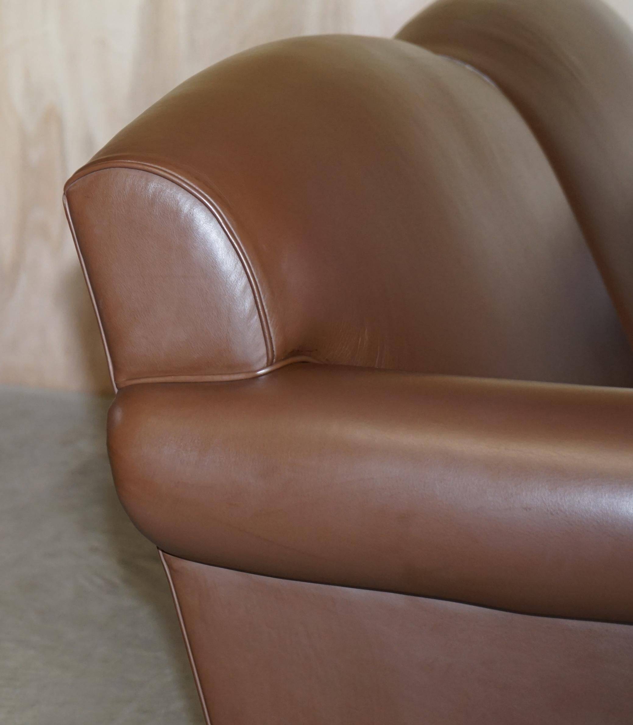 Contemporary Howard & Sons style grand sofa with brass casters.