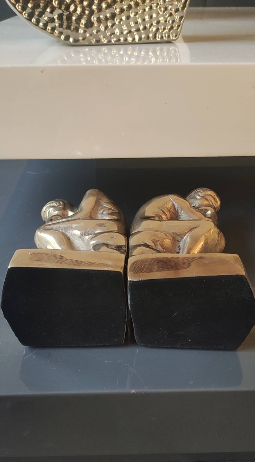 Pair of bookends inspired by Rodin's The Thinker. In gilt bronze