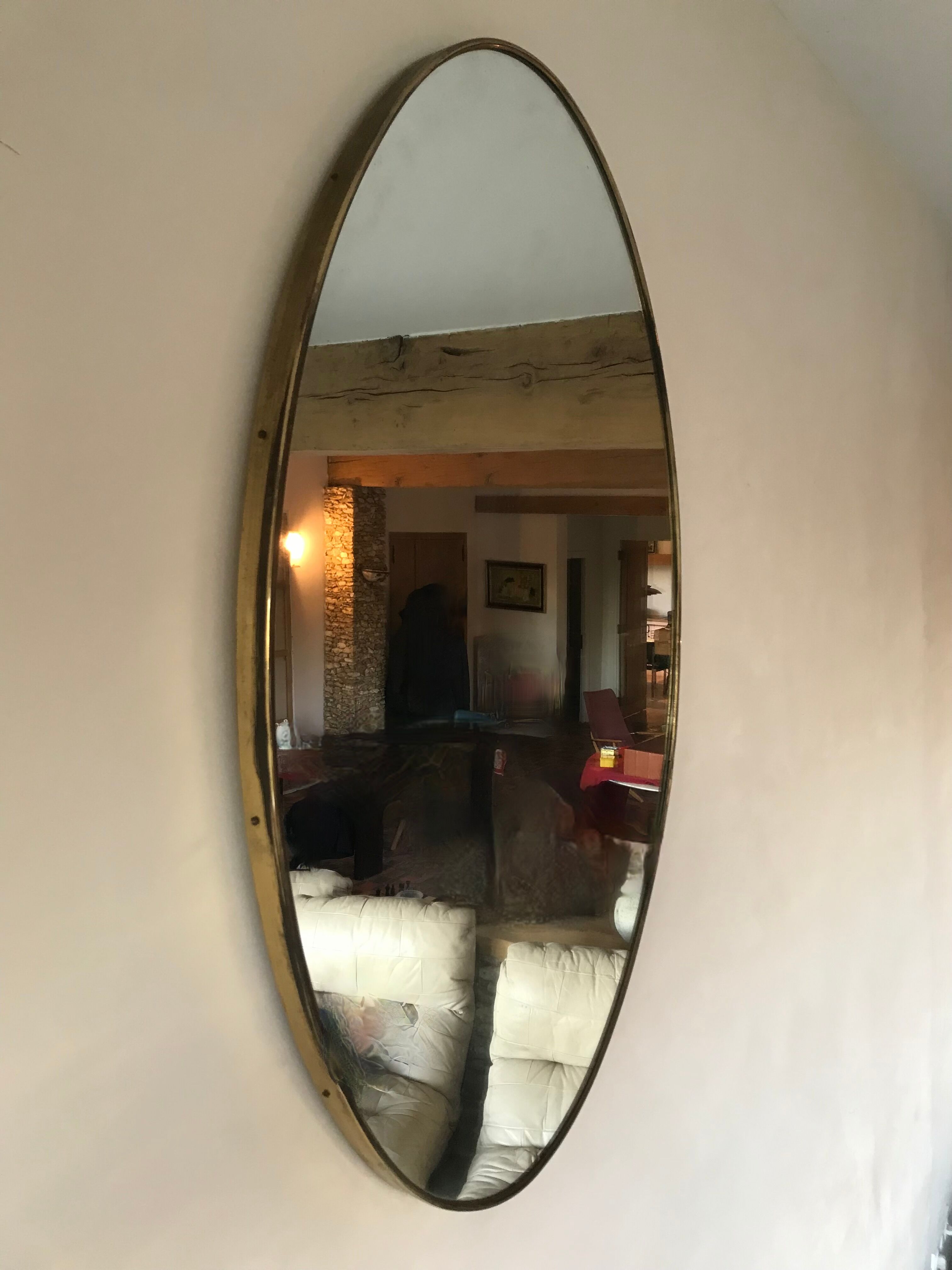 Oval brass mirror, Italy, circa 1960.