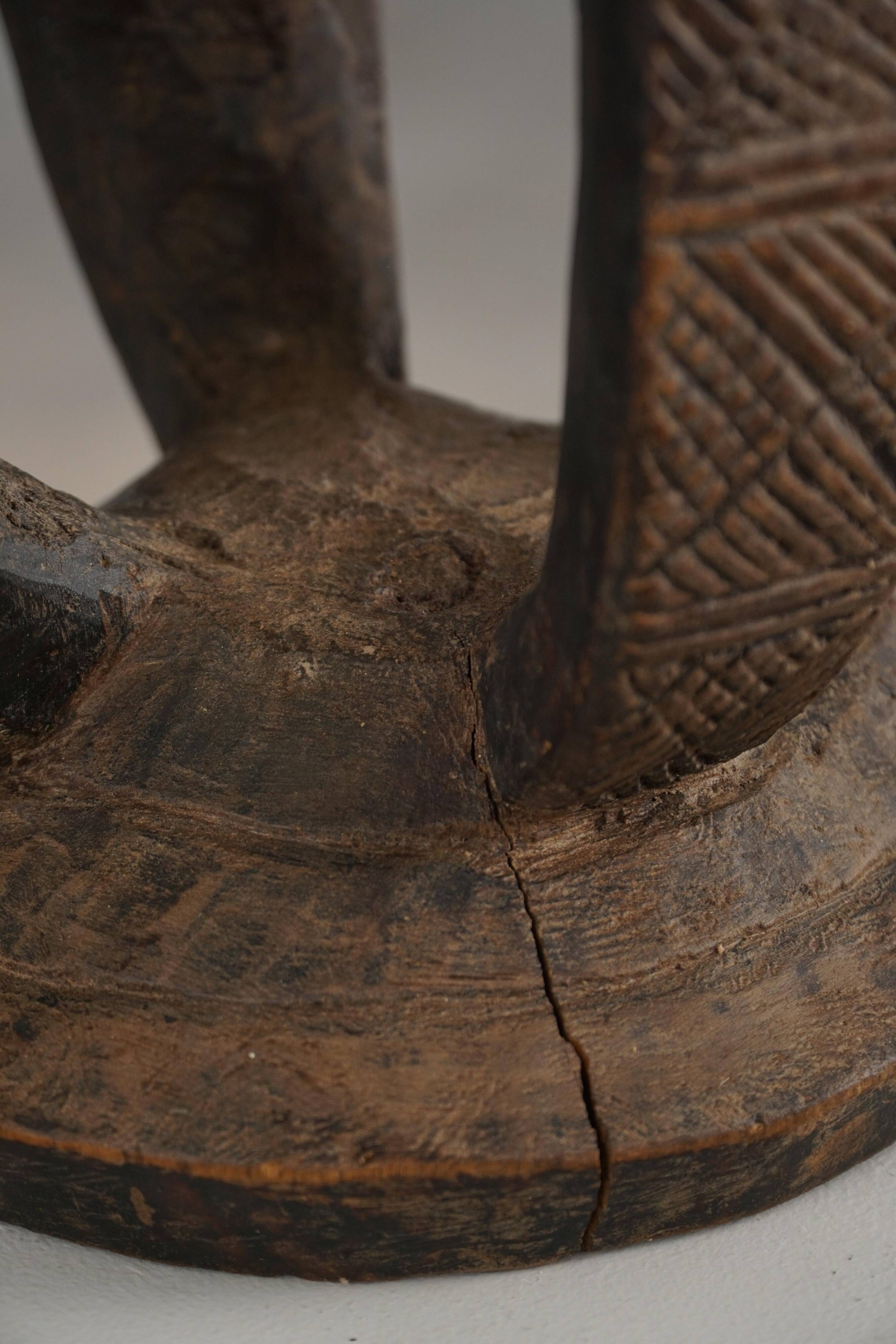 African Dogon stool from the mid-20th century, hand-carved in wood, Wabi-Sabi style.