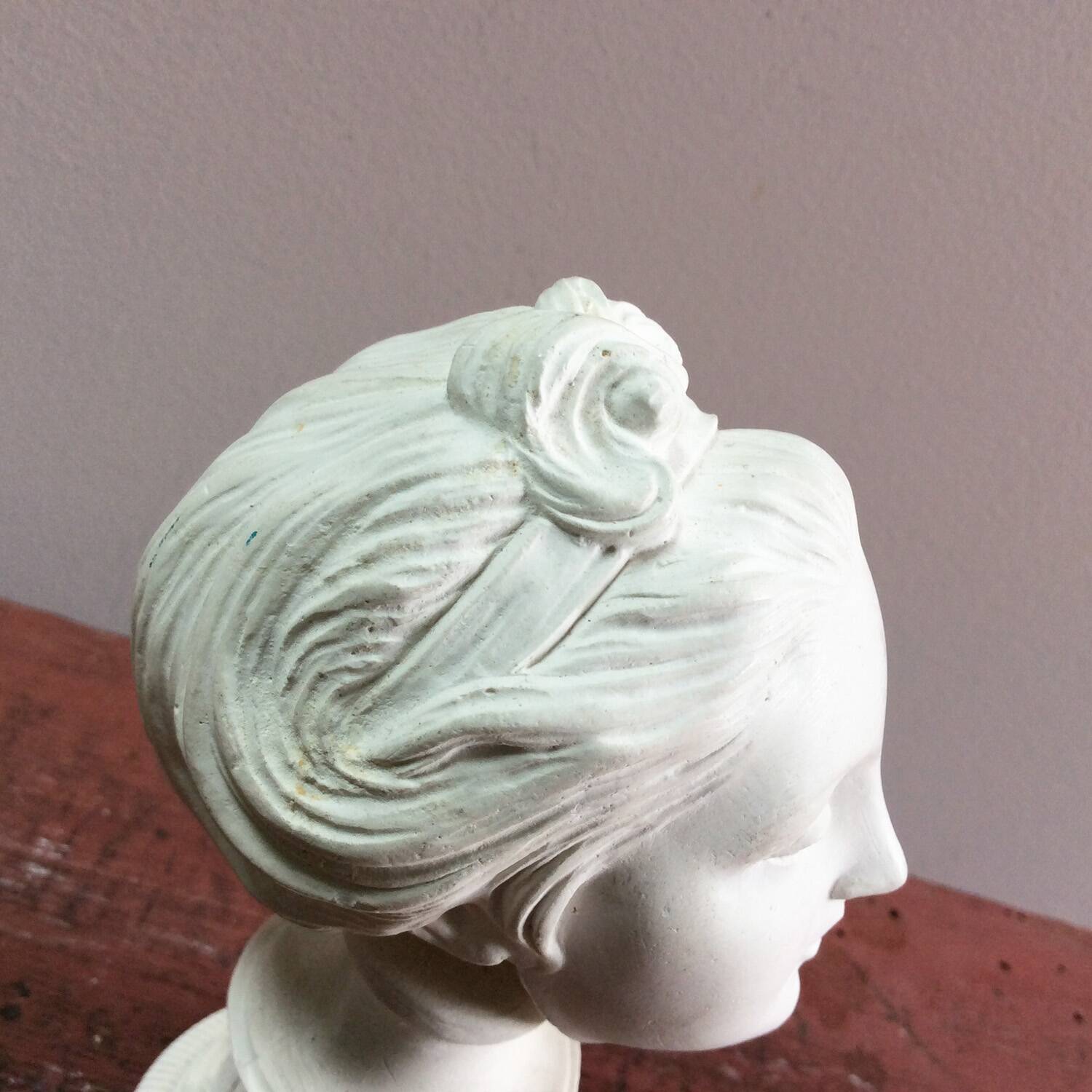 Plaster sculpture young woman with headband 1910