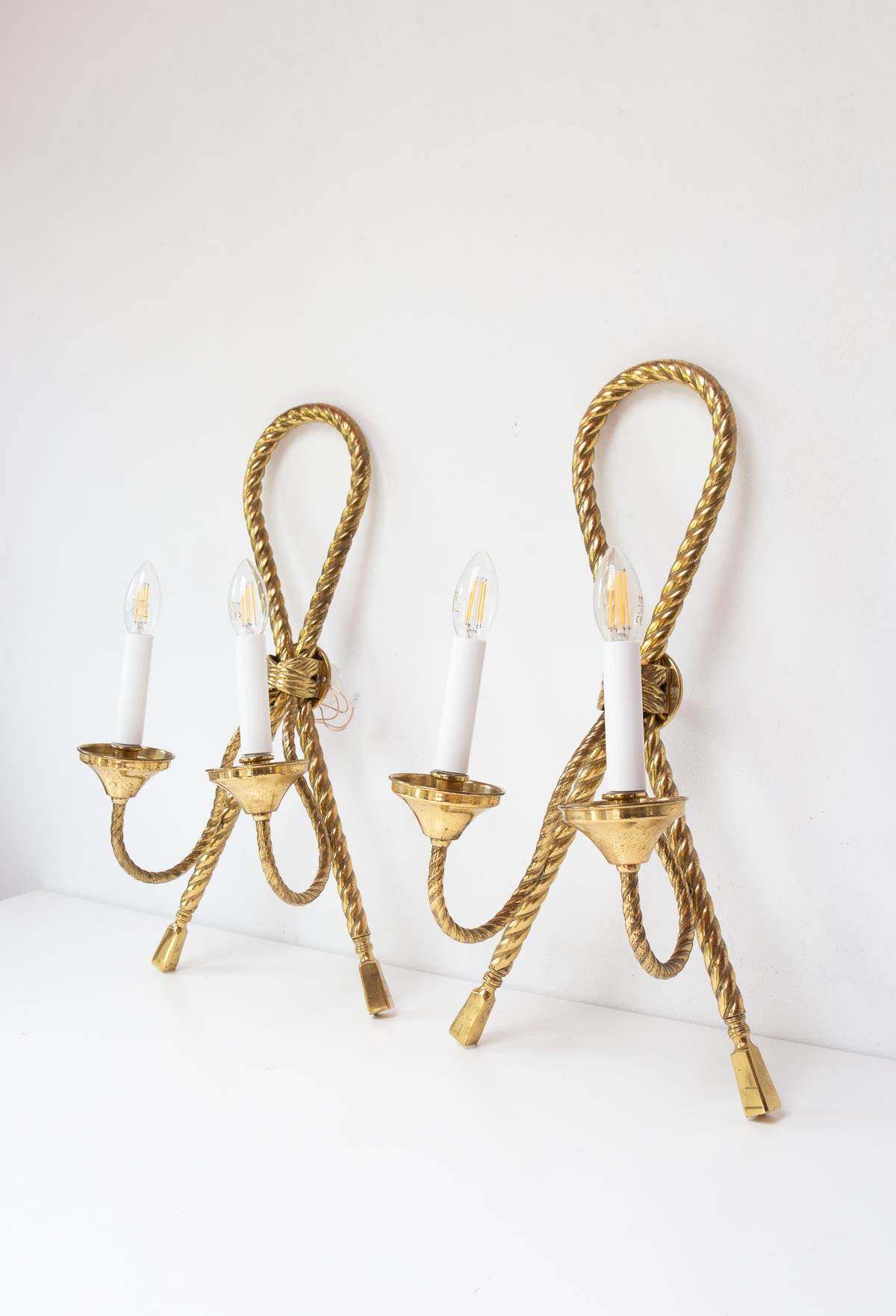 Pair of large gilded brass Noeud wall lights