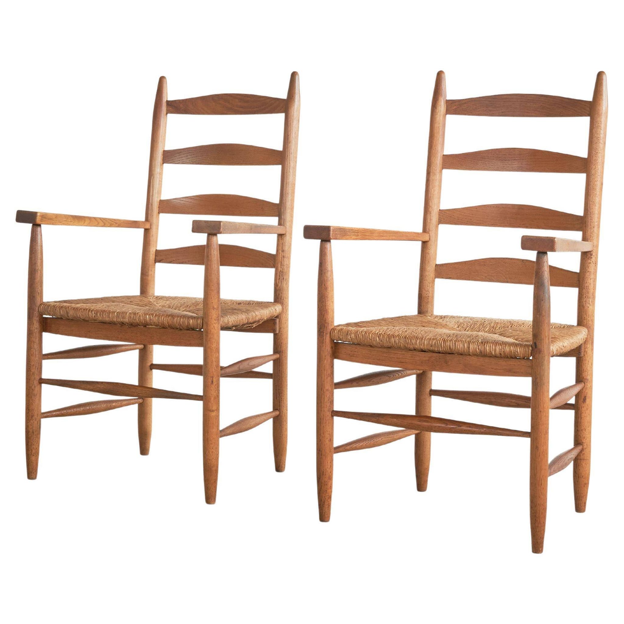 Set of 2 oak and wicker armchairs, mid-20th century.