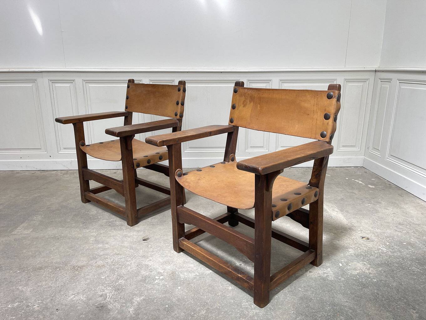 Pair of leather and walnut armchairs from the 1950s