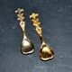 Set of 2 vintage gold metal salt spoons.