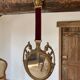 Vintage hanging mirror in gold metal and burgundy velvet – 63 × 24 cm