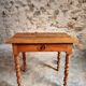 Small antique French writing table in walnut with a drawer, around 1900.