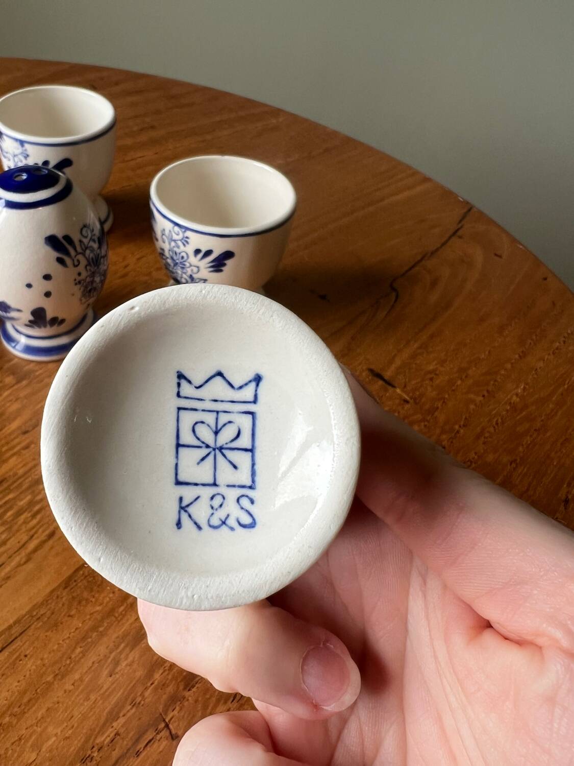 Set of 4 vintage egg cups and salt shaker in blue Delft pottery.