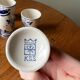 Set of 4 vintage egg cups and salt shaker in blue Delft pottery.