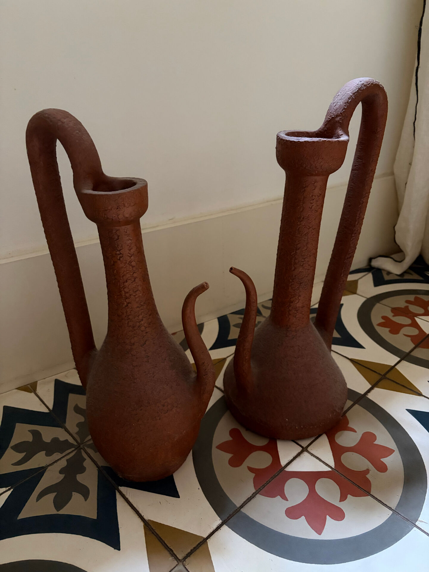 Pair of decorative terracotta jars, in the shape of a ewer.
