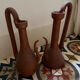 Pair of decorative terracotta jars, in the shape of a ewer.