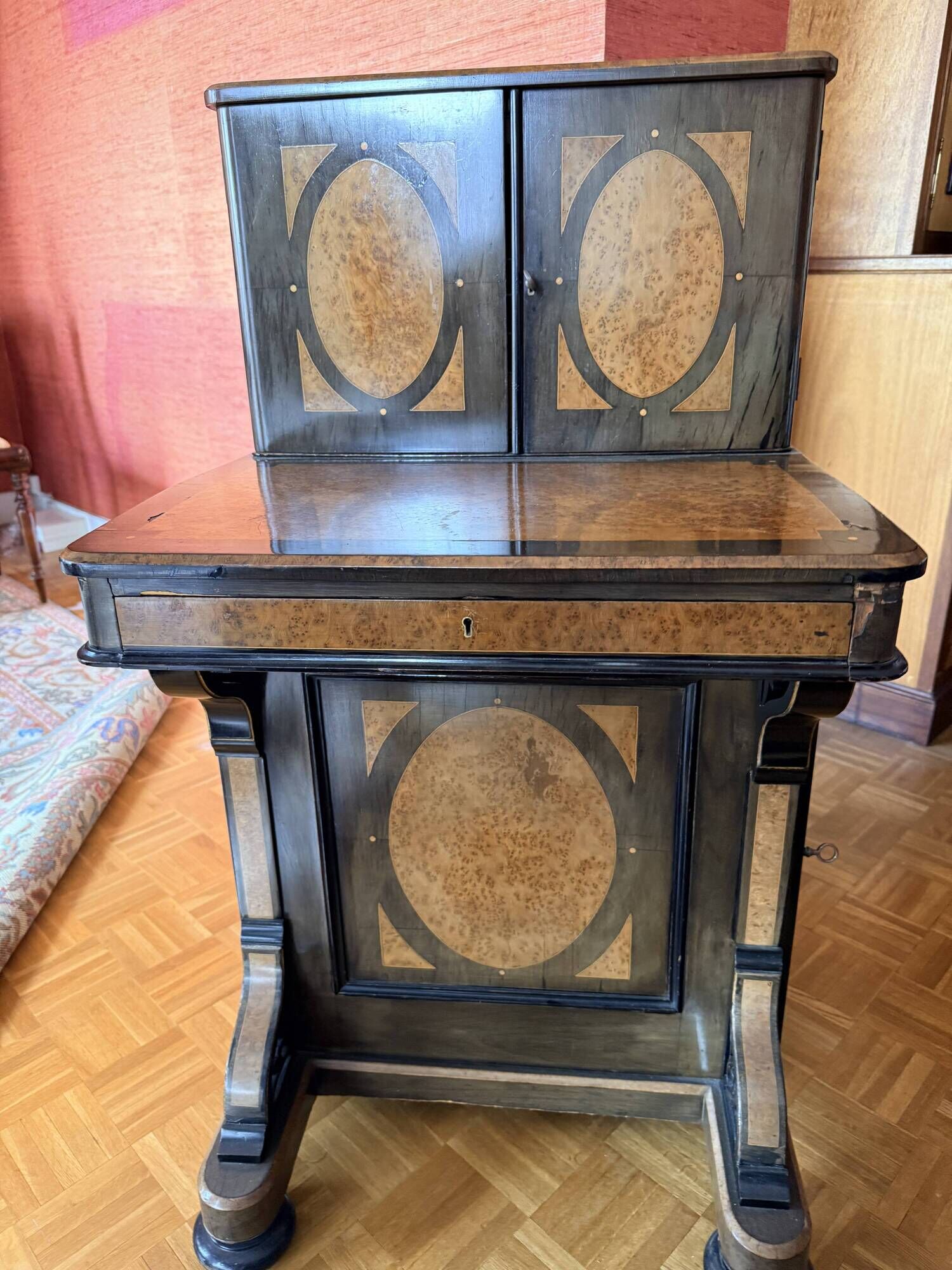 Victorian-era blackened wood and burr walnut Davenport.