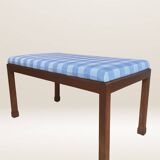 Ottoman coffee table in wood and gingham fabric.