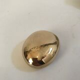 Bottle opener roller in gilded bronze by Monique Gerber