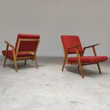 Pair of armchairs in mottled red and wood by Uluv, former Czechoslovakia 1960