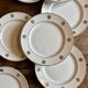 Set of 10 vintage white and gold dessert plates.