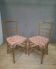 Pair of upholstered chairs in gilded wood