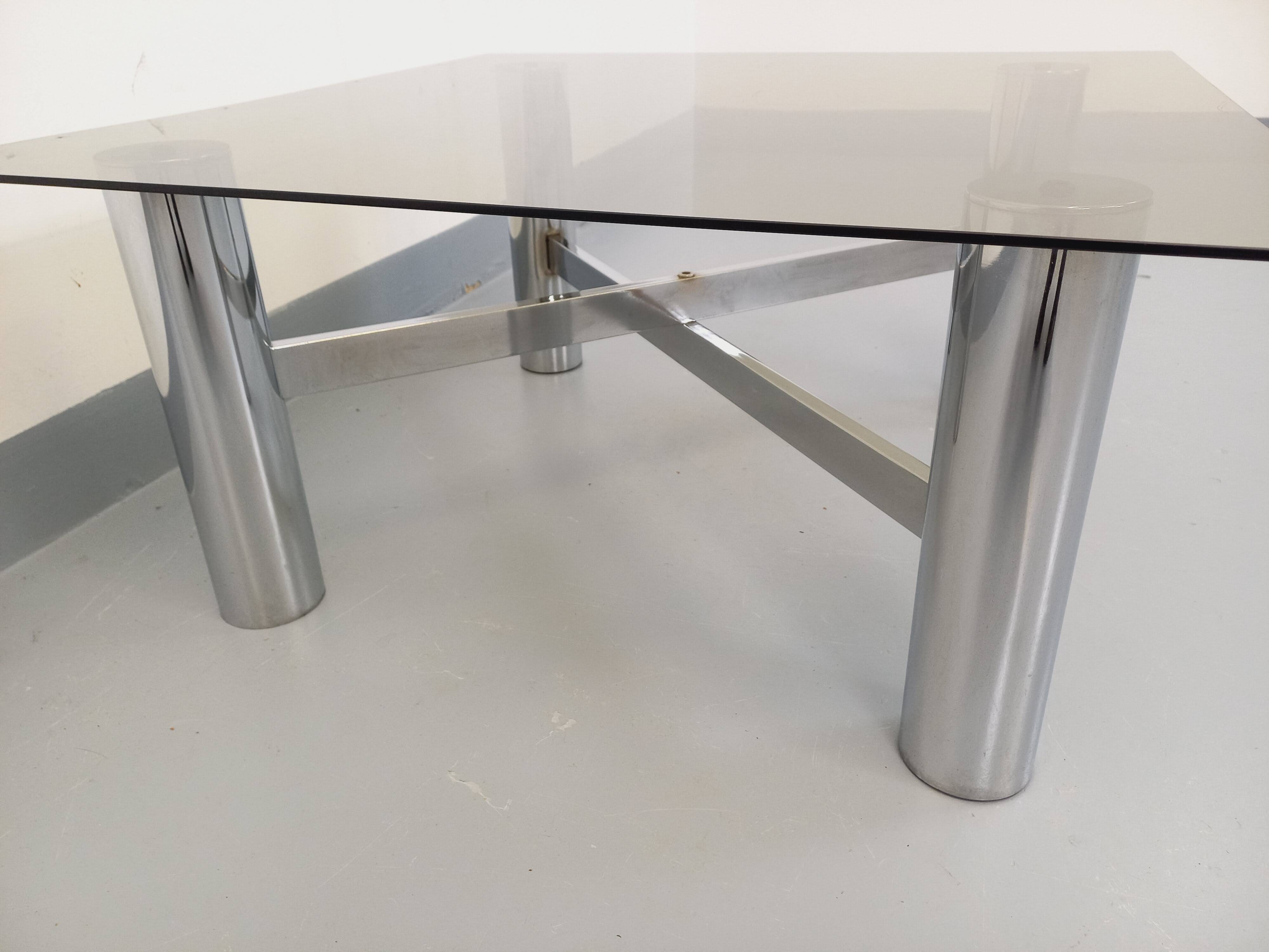 Square Italian vintage Space Age coffee table in smoked glass and metal.