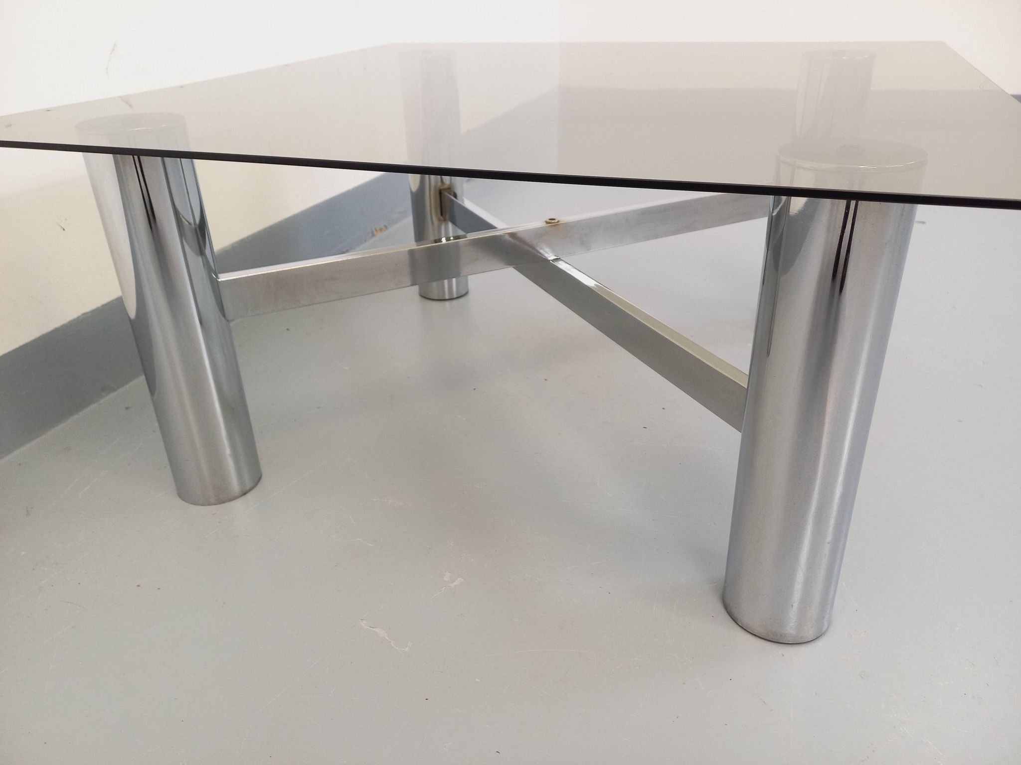 Square Italian vintage Space Age coffee table in smoked glass and metal.
