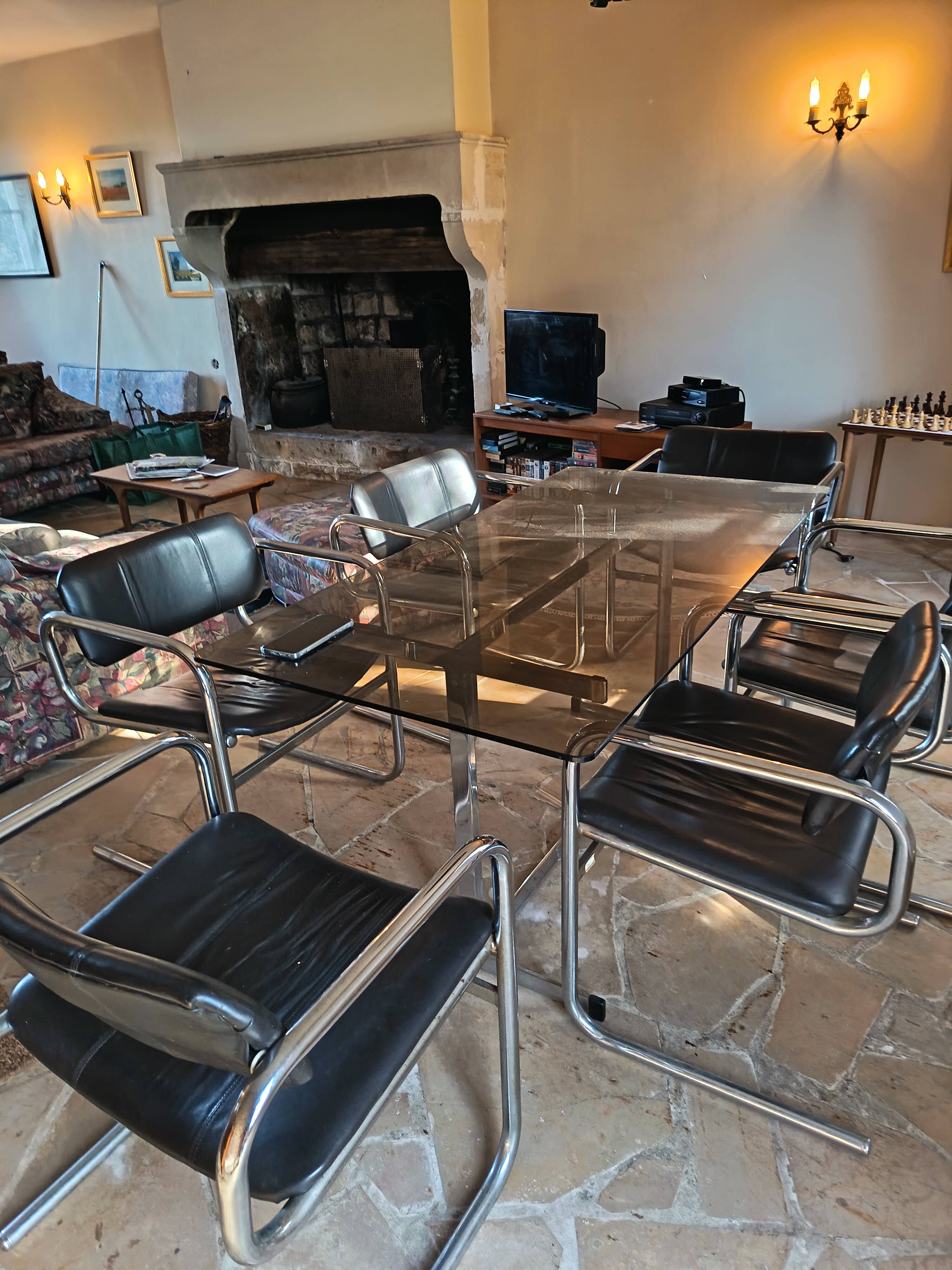 Dining table set with 6 Pieff chairs.