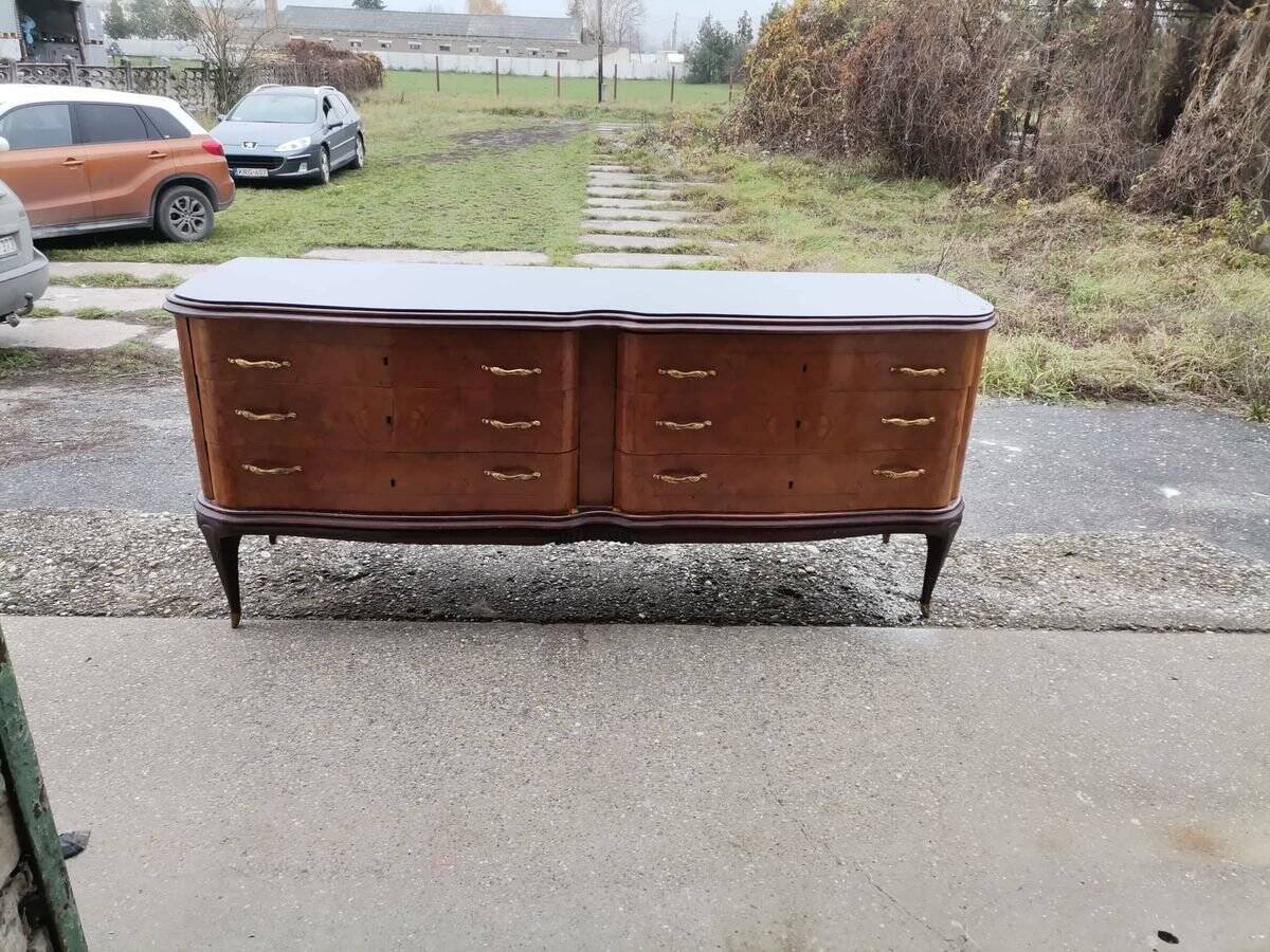 Mid-century Italian brown wooden chest of drawers, black glass top and brass handles.